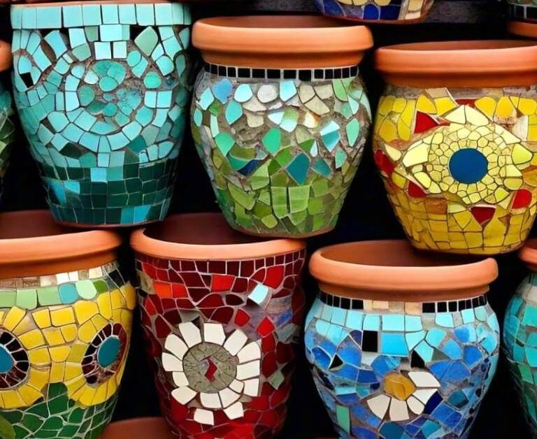 Colorful mosaic flower pots featuring intricate geometric and nature-inspired patterns in vibrant blue, green, yellow, and red tiles.